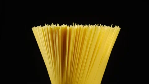 Raw pasta spaghetti isolated on black background rotating. central composition Stock-Footage 131509862