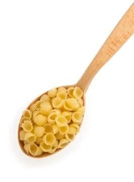 Raw pasta in spoon on white Stock Photos