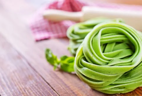 Raw pasta on a table, color raw noodles Stock Photos