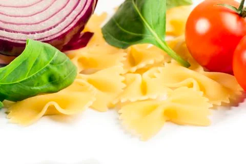 Raw pasta with vegetables Stock Photos