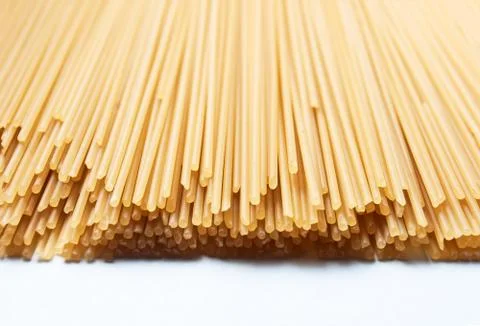 Raw pasta on a white background Stock Photos