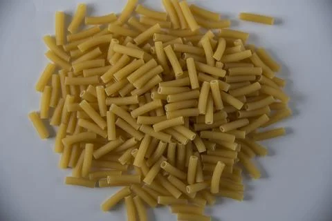 Raw pasta on white background Stock Photos