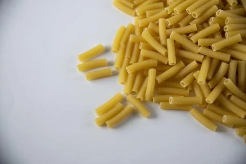 Raw pasta on white background Stock Photos