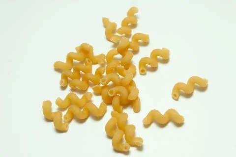 Raw pasta on a white background Stock Photos