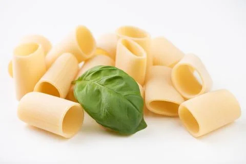 Raw pasta on white surface Foto stock