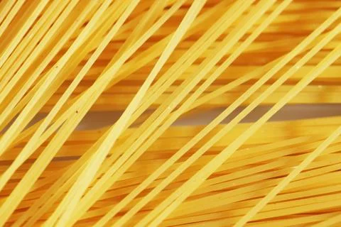 Raw pasta as whole background Stock Photos