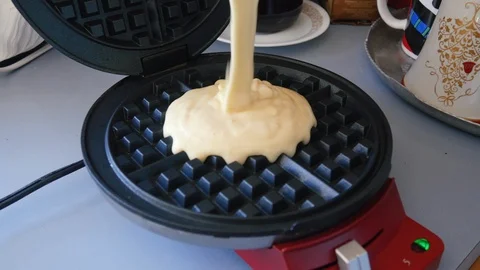 Raw Pastry Batter Being Poured into a Waffle Iron in 4k Stock Footage 86485096