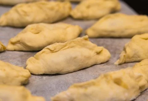 Raw patty stuffed with the process of making baking close-up, a series of bla Stock Photos