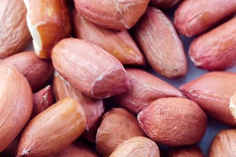 Raw peanuts for background and texture. peeled peanuts close up macro shot Stock Photos