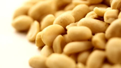 Raw peanuts, rotating on the surface. Overhead view. Colors out of camera. No co Stock Footage 94142982