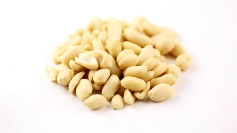 Raw peanuts, rotating on the surface. Overhead view. Colors out of camera. No co Stock Footage 94142983