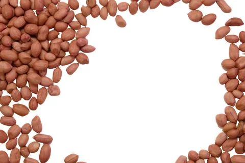 Raw peanuts scattered on a white background Stock Photos