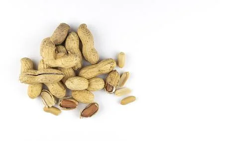 Raw peanuts on a white background, top view. Unshelled peanuts. 库存照片