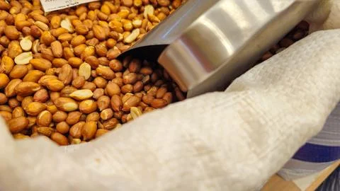 Raw peanuts without shells in a white bag Foto stock
