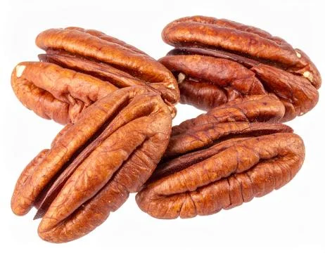 Raw Pecans Isolated on White Background, Brown Nuts with Rich Flavor and He.. Stock Photos
