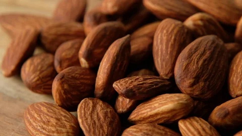 Raw Peeled almonds nuts closeup rotating, macro shot Stock Footage 125291845