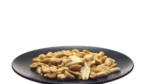 Raw peeled peanuts fried with salt. Rotation. Snack closeup. Stock Footage 102206125