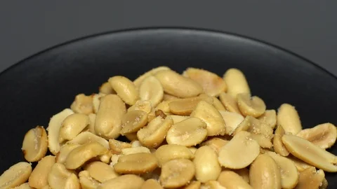 Raw peeled peanuts fried with salt.  Rotation. Snack closeup. Peanuts in a bowl. Stock Footage 102206335