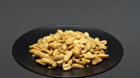 Raw peeled peanuts fried with salt.  Rotation. Snack closeup. Peanuts in a bowl. Stock Footage 102206350