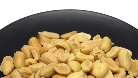 Raw peeled peanuts fried with salt. Rotation. Snack closeup. Stock Footage 102206358