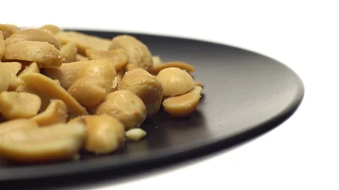 Raw peeled peanuts fried with salt. Rotation. Snack closeup. Stock Footage 102206536