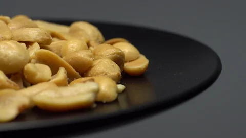 Raw peeled peanuts fried with salt.  Rotation. Snack closeup. Peanuts in a bowl. Stock Footage 102206545