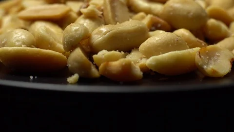 Raw peeled peanuts fried with salt.  Rotation. Snack closeup. Peanuts in a bowl. Stock Footage 102206933