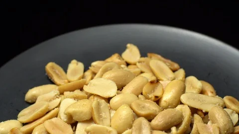 Raw peeled peanuts fried with salt.  Rotation. Snack closeup. Peanuts in a bowl. Stock Footage 102206988