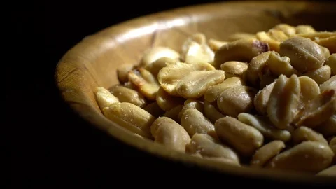 Raw peeled peanuts fried with salt.  Rotation. Snack closeup. Peanuts in a bowl. Stock Footage 102207472
