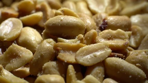 Raw peeled peanuts fried with salt. Rotation. Snack closeup. Stock Footage 102207677