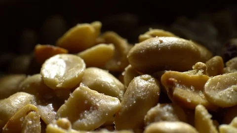 Raw peeled peanuts fried with salt.  Rotation. Snack closeup. Peanuts in a bowl. Stock Footage 102207683