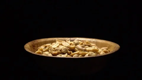 Raw peeled peanuts fried with salt.  Rotation. Snack closeup. Peanuts in a bowl. Stock Footage 102207831