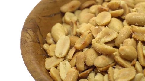 Raw peeled peanuts fried with salt. Rotation. Snack closeup. Stock Footage 102209226