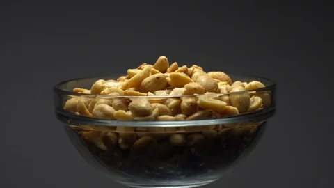 Raw peeled peanuts fried with salt.  Rotation. Snack closeup. Peanuts in a bowl. Stock Footage 102234264