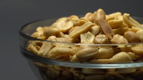 Raw peeled peanuts fried with salt.  Rotation. Snack closeup. Peanuts in a bowl. Stock Footage 102234496