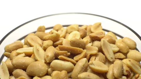 Raw peeled peanuts fried with salt. Rotation. Snack closeup. Stock Footage 102234749