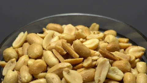 Raw peeled peanuts fried with salt.  Rotation. Snack closeup. Peanuts in a bowl. Stock Footage 102234865