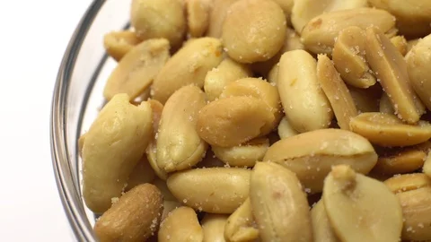 Raw peeled peanuts fried with salt. Rotation. Snack closeup. Stock Footage 102234971