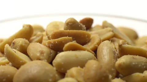 Raw peeled peanuts fried with salt. Rotation. Snack closeup. Stock Footage 102235074