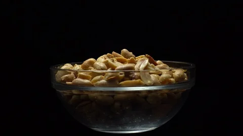 Raw peeled peanuts fried with salt.  Rotation. Snack closeup. Peanuts in a bowl. Stock Footage 102235198