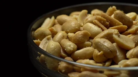Raw peeled peanuts fried with salt.  Rotation. Snack closeup. Peanuts in a bowl. Stock Footage 102235295