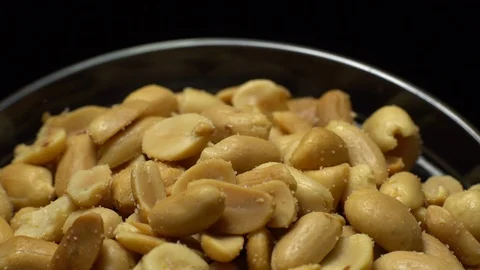 Raw peeled peanuts fried with salt. Rotation. Snack closeup. Stock Footage 102235364