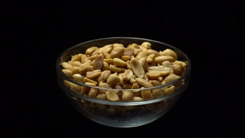 Raw peeled peanuts fried with salt.  Rotation. Snack closeup. Peanuts in a bowl. Stock Footage 102235379