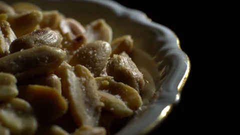 Raw peeled peanuts fried with salt.  Rotation. Snack closeup. Peanuts in a bowl. Stock Footage 102235488