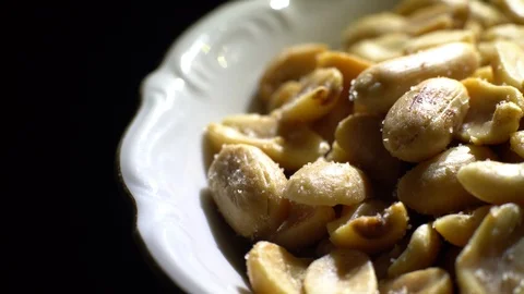 Raw peeled peanuts fried with salt.  Rotation. Snack closeup. Peanuts in a bowl. Stock Footage 102235555