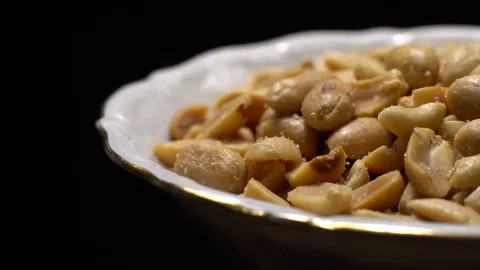 Raw peeled peanuts fried with salt.  Rotation. Snack closeup. Peanuts in a bowl. Stock Footage 102235562