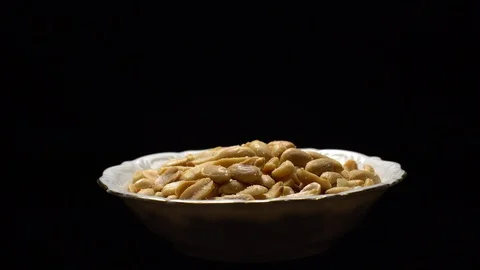 Raw peeled peanuts fried with salt.  Rotation. Snack closeup. Peanuts in a bowl. Stock Footage 102235630