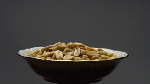 Raw peeled peanuts fried with salt.  Rotation. Snack closeup. Peanuts in a bowl. Stock Footage 102235840