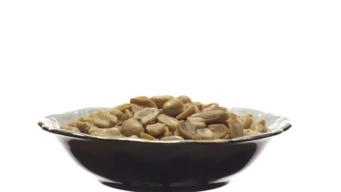 Raw peeled peanuts fried with salt. Rotation. Snack closeup. Stock Footage 102235912