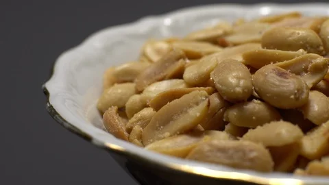 Raw peeled peanuts fried with salt.  Rotation. Snack closeup. Peanuts in a bowl. Stock Footage 102235934